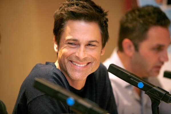 Celebrity weird facts, strange true stories about celebs, celeb facts that will make you rethink them forever, rob lowe smiling with microphone